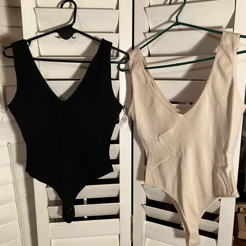 NWOT Dynamite body suits size L . Includes both